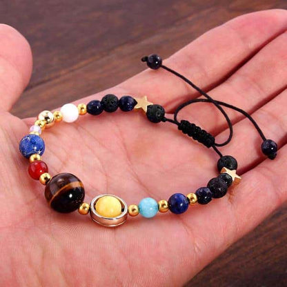 Solar System Bracelet in the palm of the hand